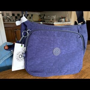 dark blue kipling bag with fuzzy gorrilla